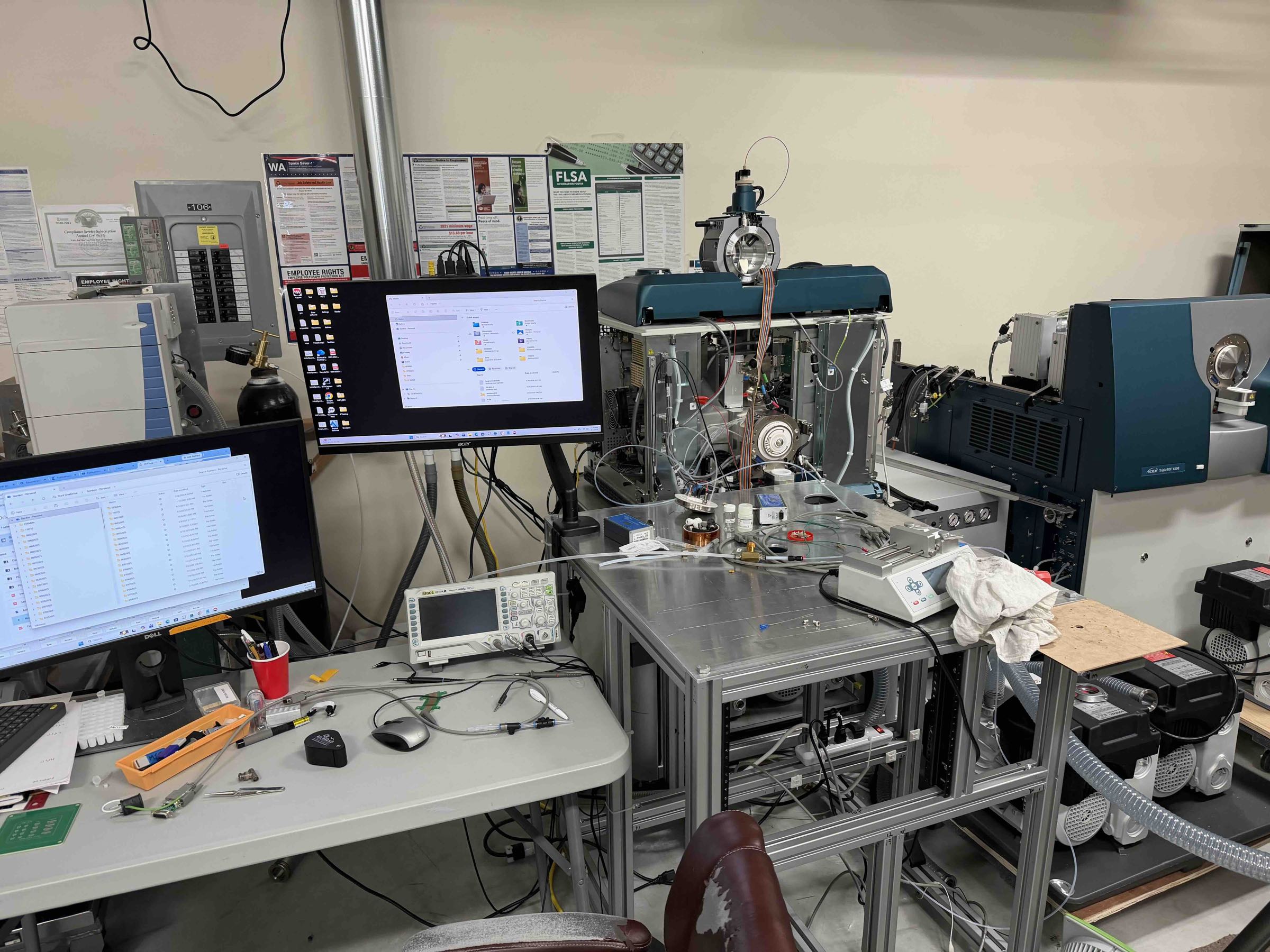 Vacuum system development lab with mass spectrometers, turbo pumps, and test chambers