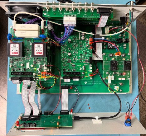 MIPS internal view showing controller board, plug-in modules, EMCO HV supplies and ribbon cable interconnects